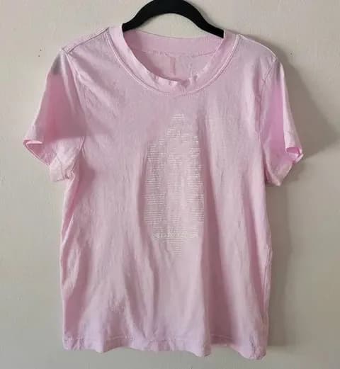 Super cute free people top it’s very worn. The pink is kind of washed out in the photo but not really in person.
