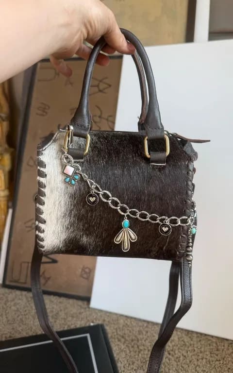 Cowhide bag With charm chain