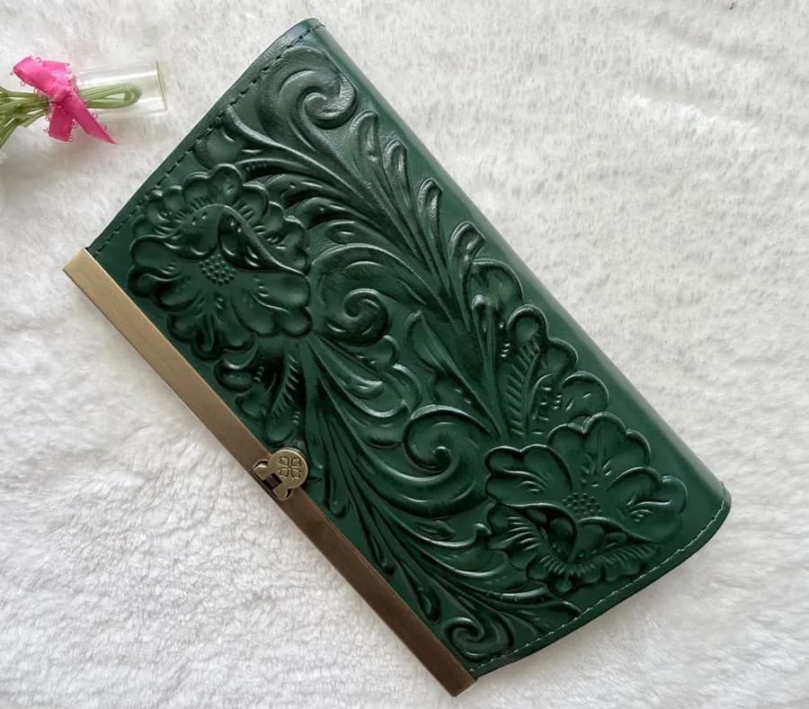elegant Cauchy Wallet from Patricia Nash green tooled floral-embossed leather.