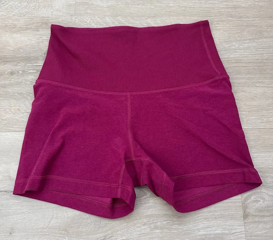 Aritzia TNA action gym shorts in purple/pink